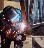 Welder welding metal